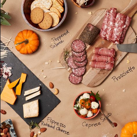 Here's a fresh idea. Use kraft paper instead of a tablecloth to add a modern flair to you holiday table. Paper Tablecloth, Paper Table, Holiday Table, Grad Parties, Holiday Tables, Kraft Paper, Cheese Board, Table Cloth, Cheese