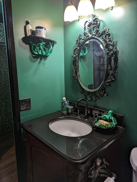 From reddit https://www.reddit.com/r/WitchesVsPatriarchy/comments/wdqr0z/i_love_how_my_bathroom_remodel_turned_out_if_i/ Goblincore Bathroom Aesthetic, Octopus Bathroom Decor Ideas, Dark Mermaid Bathroom Decor, Gothic Nautical Bathroom, Gothic Ocean Bathroom, Gothic Green Bathroom, Victorian Gothic Bathroom Ideas, Goth Nautical Decor, Moody Mermaid Bathroom