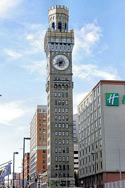 Bromo Seltzer Tower. The building's most distinctive feature are the four clock faces adorning the tower, on the North, South, East and West sides. The clock faces are adorned with the letters B-R-O-M-O S-E-L-T-Z-E-R, while the Roman numeral numbers are less prominent. From street-level to rooftop, the tower stands 288.7 feet high, and was originally adorned with a 51 foot tall Bromo-Seltzer bottle, glowing blue and rotating. Due to structural concerns however, the bottle was removed in 1936 Downtown Baltimore, Roman Numeral Numbers, Numeral Numbers, Unusual Clocks, Clock Faces, Charm City, Tower Stand, High Building, Baltimore City