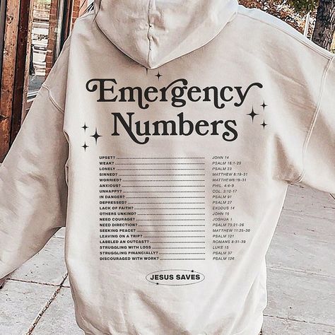 Discover comfort and strength in our Faith-Based Christian Hoodie. With a unique back print featuring emergency numbers tied to uplifting Bible verses, it's a wearable source of solace during tough times. * Q U I C K * F A C T S * ✺ 50% Cotton 50% Polyester ✺ Wash (inside out) and dry normally (on cool for best results) * S I Z I N G * ✺ Sizing is unisex so runs like men's, though not overly large ✺ Most women find their typical size works best, since they are meant to fit a touch loose ✺ For an Faith Over Fear Hoodie, Christian Hoodie Design, Christian Sweatpants, Cute Christian Sweatshirts, Christian Gifts For Him, Senior Hoodies, Hoodie Graphic Design, Christian Style, Tshirt Measurements