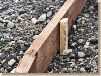 Edgings & Kerbs - Timber Edgings | Pavingexpert Wooden Edging Garden, Wooden Border Edging, Wooden Lawn Edging, Cedar Garden Edging, Wood Landscape Edging Ideas, Timber Garden Edging, Landscape Timber Edging, Timber Edging, Wood Landscape Edging