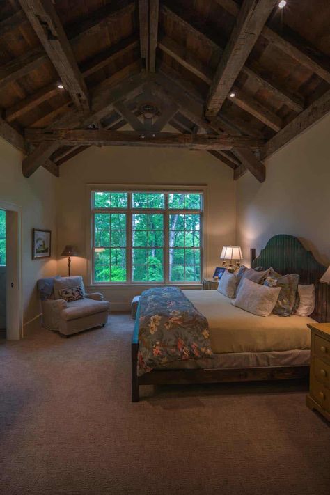 Timber frame barn house showcases inviting interiors in North Carolina Wood Ceiling Bedroom, Reclaimed Wood Ceiling, Timber Frame Barn, Hand Hewn Beams, Reclaimed Wood Beams, Barn House Design, Heart Pine Flooring, Wooden Barn, Quarter Sawn White Oak