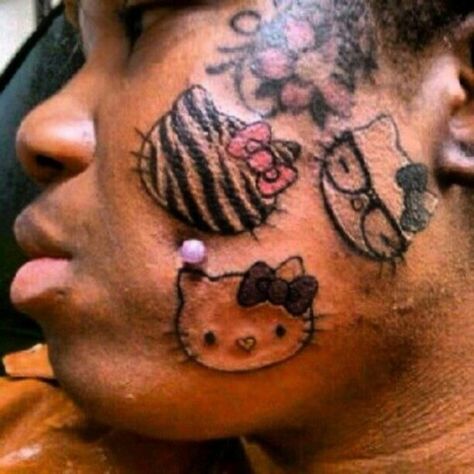 She really loves hello kitty... She'll never get a job! Tatuaje Hello Kitty, Black People Tattoos, Cheek Piercings, Hello Kitty Face, Hello Kitty Tattoos, Tattoo Fails, Mandalas Painting, Bad Tattoos, Face Tattoos