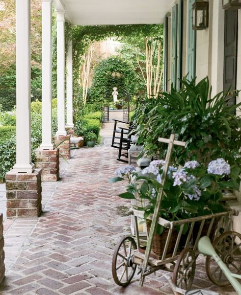 Welcome To Charleston| Charleston Magazine | Charleston, SC Brick Courtyard, Brick Porch, French Country Front Porch, Charleston Gardens, Brick Columns, Charleston Style, Courtyard Gardens, Pathway Landscaping, Porch Columns