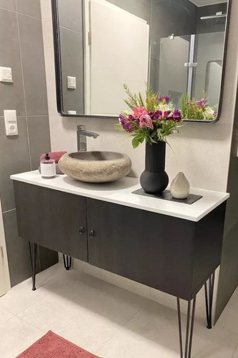 If you're remodeling your bathroom, chances are you're still on the hunt for the perfect bathroom vanity. Use the IKEA Besta to customize and create the exact look you're imagining. Add some taller hairpin legs and a bowl-shaped sink—you'll have yourself a totally custom look. #ikeahack #bestaikeahack #ikeafurniturehack #mydomaine #diybathroomvanity Ikea Besta Hacks, Besta Hacks, Besta Cabinet, Ikea Besta Cabinet, Ikea Bestå Hack, Besta Hack, Besta Ikea, Wood Desk Top, Ikea Vanity