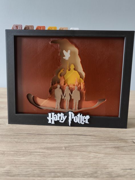 Free STL file Harry Potter Shadow Box (A) 📦・Design to download and 3D print・Cults Cricut Layered Paper Art Harry Potter, Harry Potter Cricut, Cricut Harry Potter, Harry Potter Light, Layer Pictures, Harry Potter 3d, Harry Potter Logo, Harry Hermione, Layered Art