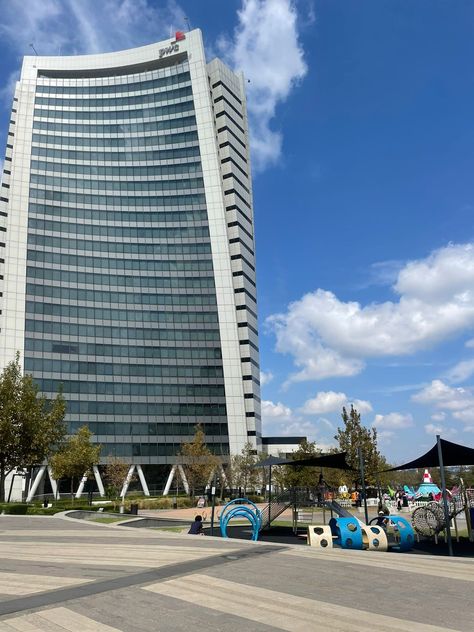 Mall of Africa play area and skyscraper with blue skies Mall Of Africa South Africa, Johannesburg Aesthetic, Johannesburg South Africa Aesthetic, Waterfall City, Mall Of Africa, Inspo Vision Board, South Africa Johannesburg, Johannesburg City, Waterfall Park