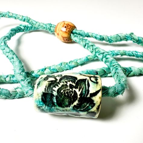 New Handmade Surly-Ramics Ceramic And Silk Adjustable Lotus Flower Barrel Bead Necklace Beautiful Turquoise Silk And Glaze Color. This Is A One Of A Kind Handmade Ceramic Barrel Bead And Upcycled Adjustable Silk Cord (Made From 100% Recycled Saree (Sari) Silk Ribbon.) The Ceramic Bead And Necklace Is Made By Me, Amy Davis Roth. I Make Each One By Hand And No Two Are Alike. It Has An All Natural Wooden Bead On The Back That Makes It Adjustable. This Is Handmade Boho At Its Best! This Necklace Has Sari Ribbon Jewelry, Sari Silk Jewelry, Ceramic Beads Necklace, Lotus Flower Necklace, Sari Silk Ribbon, Silk Jewelry, Ribbon Jewelry, Fiber Jewelry, Fabric Necklace