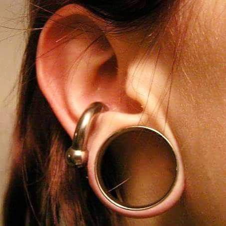 Ear gauges are a good example of an extension of the body's abilities because they stretch the ear Big Gauges Ears Stretched Lobes, Stretched Conch Piercing, Big Gauges, Stretch Ears, Stretched Ear Lobes, Bat Ears, Types Of Ear Piercings, Dark Blue Hair, Stretched Lobes