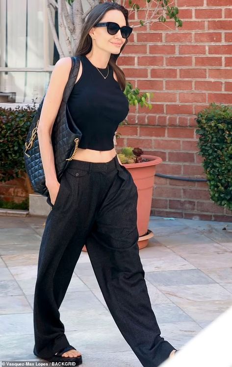 Angelina Jolie flashes her taut tummy in Lara Croft-inspired top as she steps out in Beverly Hills | Daily Mail Online Angelina Jolie Body, Angelina Jolie Style, Angelina Jolie Photos, Black Crop Top Tank, Tank Top Outfits, Feminine Outfit, Casual Street Style, Angelina Jolie, Look Fashion