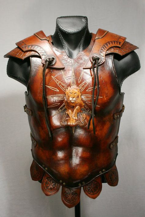 davidpowellart: Leo armor: Based on Roman and Greek styles of armor, this piece is made from 16 oz molded leather, with gold leaf details and bronze buckles. Across the shoulder pieces, the constellation Leo is set amongst sun rays and depictions of the cycles of the moon. Below it, the second lame is carved with serpent scales, supporting the chest design of the lion trampling the serpent. Unfortunately, this piece was stolen while on display. Some day I plan to make it again, with some ... Cycles Of The Moon, Leo Constellation Tattoo, Steampunk Stuff, Leo Constellation, Istoria Artei, Chest Design, Cosplay Armor, The Serpent, Leather Armor