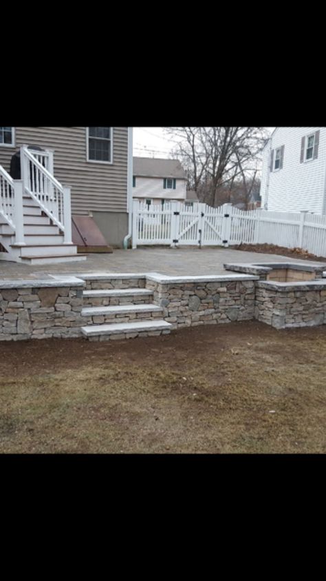 Back Porch Steps Down To Patio, Step Down Patio Ideas, Elevated Patio Ideas, Concrete Patio With Retaining Wall, Raised Patio Ideas Retaining Walls, Raised Concrete Patio, Steps Down To Patio, Patio With Retaining Wall And Steps, Elevated Patio With Retaining Wall