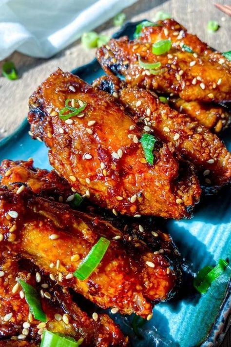 Korean soy garlic chicken wings garnished with sesame seeds and sliced green onions, served on a rectangle blue plate. Soy Garlic Chicken Wings, Soy Garlic Sauce, Wings Recipe Oven, Chicken Wings Recipe Oven, Korean Fried Chicken Wings, Wings Crispy, Korean Chicken Wings, Soy Garlic Chicken, Air Fry Oven