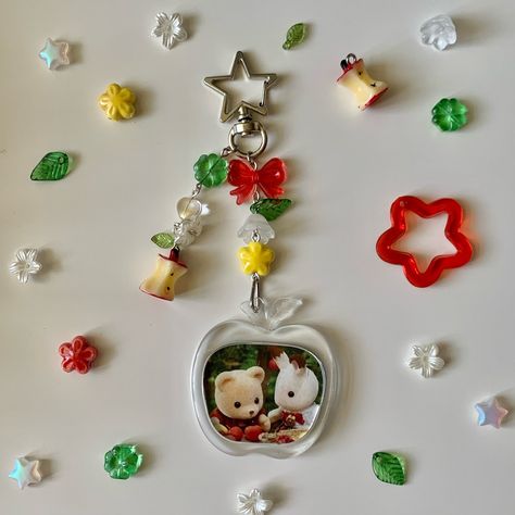 ❝ sylvanian families keychains ❞ 🏘️🌳 ✧ please read highlights before purchasing‼️ ✧ dm to purchase (if dms don’t work, comment your order) ↝ 🍎 apple picking : $14 [ available ] ↝ 🌧️ rainy day : $14 [ available ] 🏷️ #sylvanianfamilies #シルバニアファミリー #calicocritters #handmade #handmadekeychain #diy #keychains #jewelry #beads #trinket #accessories #smallbusiness #aesthetic #shopsmall #explore #explorepage #viral #fyp #art Smallbusiness Aesthetic, Apple Keychain, Eyestrain Art, Diy Keychains, Diy Beaded Rings, Apple Theme, Photo Keychain, Apple Picking, Jewelry Beads