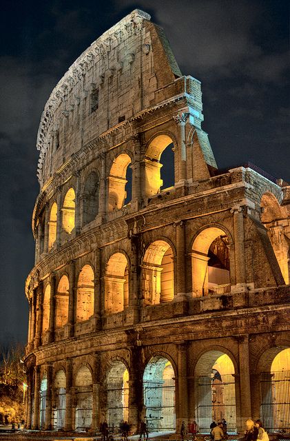 Okay, so the Colosseum wasn't built as of A.D. 65, but the amphitheaters and circuses of the day had a similar presentation, with multi-story archways and pillars (Source: Flickr, Captain Blackadder, The Colosseum at Night) Rome Italy Colosseum, Istoria Artei, Colosseum Rome, Roman Ruins, The Colosseum, Famous Landmarks, Rome Italy, Places Around The World, Albania