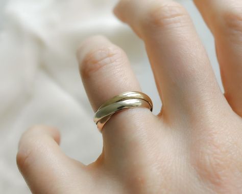 A vintage 9ct gold tri-colour trinity ring on offer—a true masterpiece that’s sure to dazzle. ✨ Weighing over 3 grams, this ring is a visual delight with its three exquisite 2mm wide bands, crafted in stunning tri-colour gold. Symbolising unity and infinite love, this trinity ring showcases remarkable craftsmanship. Imprinted with makers marks and London hallmarks from the year 1986, it carries the legacy of British artistry and authenticity. The ring is in flawless condition, ready to ador... Trinity Ring, Tri Colour, Infinite Love, Wide Bands, Tri Color, Makers Mark, Instagram A, London, Band