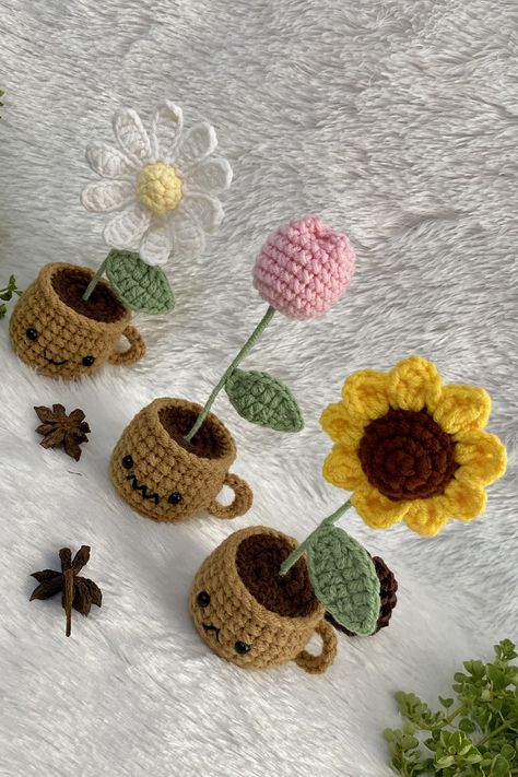 CROCHET IDEAS : Easy Crochet Mini Pot Tutorial | Pretty Crochet Mini Flower Sunflower + Crochet Daisy + Crochet Tulip 💕🌷 #crochettutorial #crochetflower #crochetideas Materials: 1. Cotton yarn 4ply size 2 mm. 2. Crochet hook No.4 size 2.5 mm. 3. Crochet hook No.5 size 3 mm. 4. Eyes 6 mm. 2 pcs. 5. Wire length 12 cm. 6. Polyester fiber 7. Scissors 8. Needle Finished size: Height 15 cm. Width 6 cm. Crochet Mini Flower Pot, Crochet Mini Sunflower, Crochet Tulip, Sunflower Crochet, Daisy Crochet, Mini Sunflowers, Flower Sunflower, Pretty Crochet, Sunflower Daisy