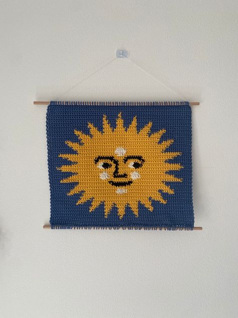 This product is a downloadable pattern for the Sun Face tapestry, no physical product is included. The image shown is a crochet piece, but this can also be used for knitting, cross stitch and other crafts. The PDF is a colour coded graph and it's 65x65 rows. The crochet sample I made ended up being 25x25cm. This pattern is for personal use only. Tapestry Pattern, Pixels Art, Crochet Spring, Crochet Blanket Designs, Sun Face, Tapestry Crochet Patterns, Crochet Inspo, Custom Ideas, Crochet Tapestry