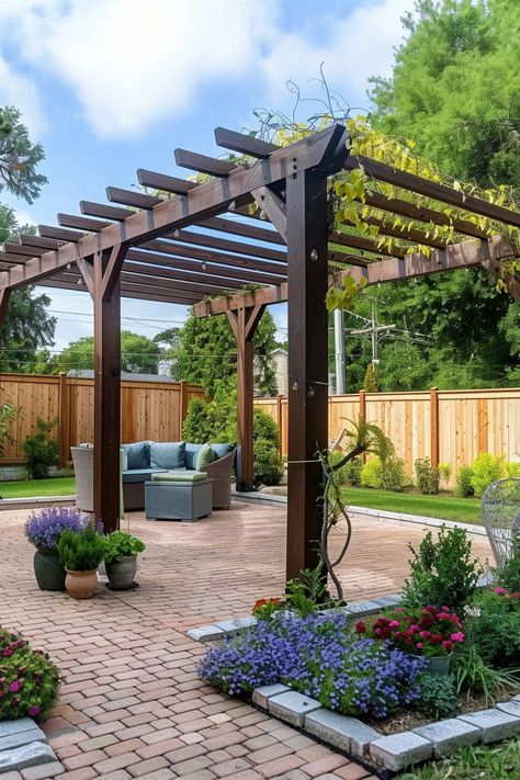 Wooden pergola in a backyard, with a seating area and potted plants on a paved patio surrounded by a wooden fence and lush greenery. Backyard Pergola Ideas, Pergola Ideas, Wood Pergola, Backyard Pergola, Living Room Loft, Backyard Spaces, Brick Patios, Backyard Retreat, Pergola Patio