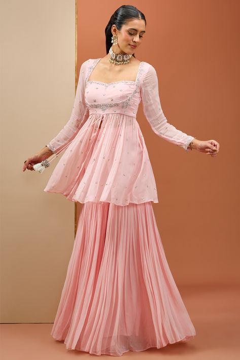 Baby-pink peplum top with a hand-embroidered neckline paired with a georgette sharara and organza dupatta Top And Sharara Set, Sharara Outfits, Peplum Top Outfits, Kurta And Sharara Set, Pink Sharara, Kurta And Sharara, Pink Dress Outfits, Pink Peplum Top, Georgette Sharara