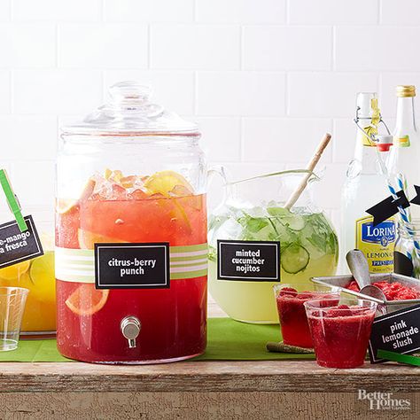 Stock your drink station with premixed drinks and take the guess work out of entertaining. Here, we used a variety of drinks, including purchased lemonade, mojitos, and citrus-berry punch. You'll Need: Large drink dispensers, the cocktail of your choice, purchased lemonade, glasses, and straws. Drink Dispenser Recipes, Beverage Stations, Mojito Bar, Mojito Drink, Drink Stations, Pitcher Cocktails, Wedding Drink Station, Cocktail Station, Berry Punch