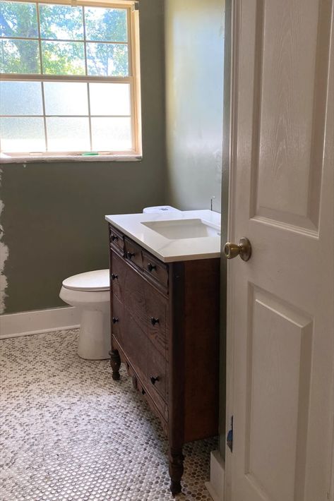 Bathroom remodel with conversion of vintage dresser into a bathroom vanity. White penny tile floors with moody green walls. Dresser To Vanity Bathroom, Antique Dresser Bathroom Vanity, Dresser Into Bathroom Vanity, Bathroom Vanity Renovation, Bathroom Vanity Antique, Vanity Antique, Dresser Vanity Bathroom, Vintage Bathroom Vanity, Antique Bathroom Vanity