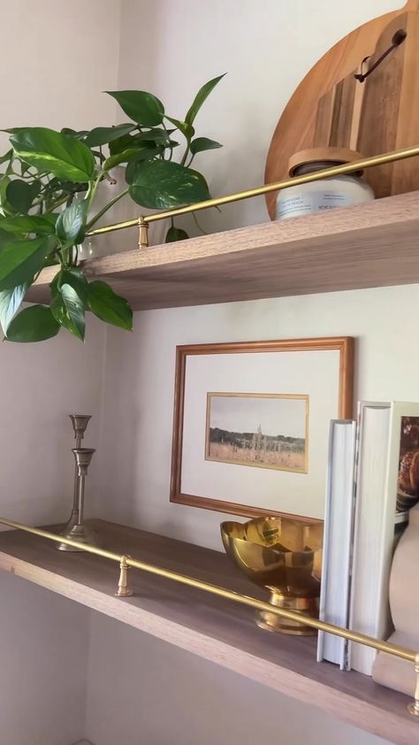 Gold Shelves Kitchen, Floating Shelves With Gold Brackets, Oak Shelves Brass Brackets, Wood And Metal Floating Shelves, Open Shelves With Brass Rail, Shelves With Brass Railing, Gold Shelf Brackets Kitchen, Vintage Brass Shelf Rail, Shelves With Brackets Living Room