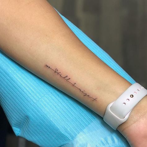 Still I Rise Small Forearm Tattoos For Women Writing, Women Small Forearm Tattoo, Side Wrist Arrow Tattoos For Women, Written Wrist Tattoo, Words Tattoo Wrist, Small Empowering Tattoos, Places On Arm For Tattoos, Side Wrist Tattoos For Women Quotes, Sideways Wrist Tattoo