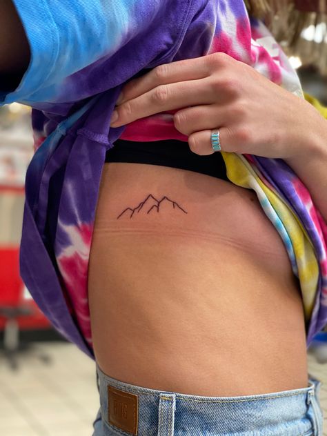 Blue Ridge Tattoo, Mountain Tattoo Ribcage, Rib Tattoo Mountain, Ribcage Mountain Tattoo, Mountain And Lake Tattoo Simple, Rib Mountain Tattoos For Women, Rib Cage Mountain Tattoo, Alaskan Tattoos For Women, Mountain Rib Tattoo