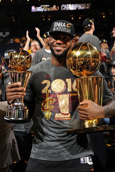 LeBron James of the Cleveland Cavaliers celebrates with the Larry O'Brien NBA Championship Trophy and the Bill Russell NBA Finals Most Valuable... Lebron James Cleveland Cavaliers, Lebron James Cleveland, King Lebron James, King Lebron, Cleveland Cavs, Dwyane Wade, Nba Pictures, Basketball Art, Nba Season