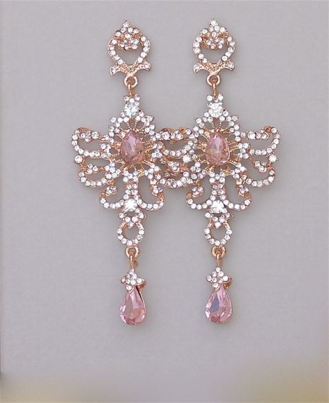 "Stunning blush chandelier earrings designed to add the Wow! factor. Vintage inspired long soft rose gold earrings, are studded with Swarovski clear crystals and sparkling pink blush   teardrops. These are light and comfortable earrings, and we are happy to supply a pair of 'comfort back' silicone post pads with your purchase if requested, which help support long earrings. (please leave message at checkout) Measurements: Length: 3.5\" (9 cm) Width -1.5\" (3.8 cm) Nickel free earpost. Set in tarn Rose Gold Bridal Earrings, Pink Crystal Earrings, Statement Earrings Wedding, Crystal Statement Earrings, Gold Bridal Earrings, Earrings Rose Gold, Rose Gold Bridal, Magical Jewelry, Pink Bridal