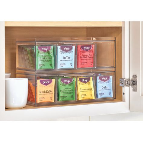 Organise your pantry and cupboards with the iDesign Crisp Tea Storage. Storage containers are very on-trend at the moment, and it’s not hard to see why! Make your fridge and pantry the organised space of your dreams with the modular Crisp range. Made from durable BPA-free plastic, keep just about anything organised in this handy dividable storage solution that's ideal for keeping your tea bags, coffee pods and sugar sachets neat, tidy and within easy reach. The open-top design and inbuilt handle Tea Organization, Tea Bag Organizer, Kitchen Cabinets And Countertops, Compartment Organizer, The Home Edit, Cabinets And Countertops, Tea Storage, Pantry Shelf, Custom Storage