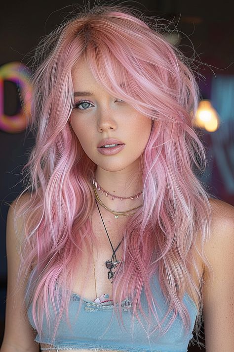 A woman with a pastel pink long shag haircut featuring airy, feather-light layers. Pink Shag Hair, Pink Layered Hair, Faux Mullet, Blonde Hair With Pink Tips, Long Choppy Haircuts, Golden Ombre, Long Shag Hairstyles, Long Pink Hair, Cotton Candy Skies