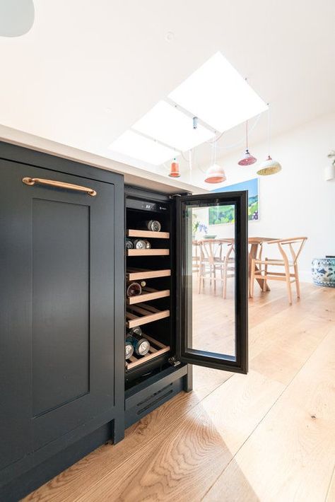 Incorporating a wine fridge into a kitchen island can be a stylish and functional addition to your kitchen space. When designing your kitchen island with a wine fridge, consider integrating the fridge seamlessly into the island's design as adding a wine fridge adds functionality to the island, making the most of the available space. If you design it to fit in the right way it will become a convinient and fun part of your kitchen space. Read more here. Wine Cooler In Island Kitchen, Wine Cooler Island, Adding Wine Fridge To Island, Drink Fridge In Island, Kitchen Island With Wine Cooler, Island Kitchen With Wine Fridge, Kitchen Island With Glass Doors, Island Wine Fridge, Wine Fridge Island