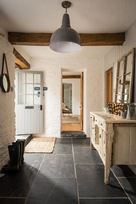 Love this simple rustic style country entry with large stone floors, rustic timber beams, rendered stone/brick walls, and antique furniture. A lovely warm, mudroom entry and especially love the vintage timber doors. Modern Entrance, Casa Country, Slate Flooring, Style Cottage, 아파트 인테리어, Cottage Interiors, Entrance Hallway, Style At Home, Barn Style