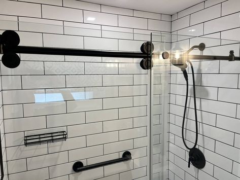 We love how this clients bathroom came out! The white subway tile is such a classic look, but the black grout lines and fixtures give it a bold & modern feel. #transitionaldesign #longislandcontractor #bathroomremodel Tiles Dark Grout, Large White Tiles, Dark Grout, Black Grout, White Subway Tile, Subway Tiles, White Tiles, Subway Tile, Grout