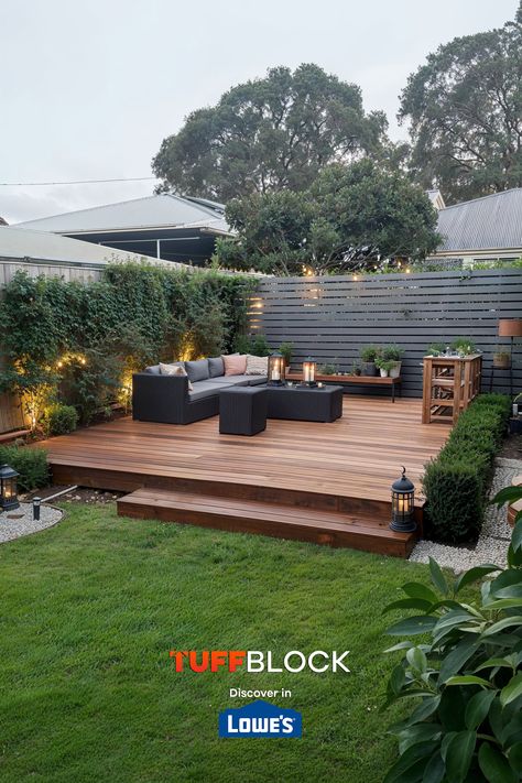 beautiful ground level deck in small yard with lights, candles, lush green grass and an edging garden with trimmed bushes Deck Platform Ground Level, Backyard Deck Landscaping, Deck Ideas Ground Level, Raised Deck Ideas, Ground Level Deck Ideas, Ground Level Patio, Low Profile Deck, Deck Extension, Mixing Concrete