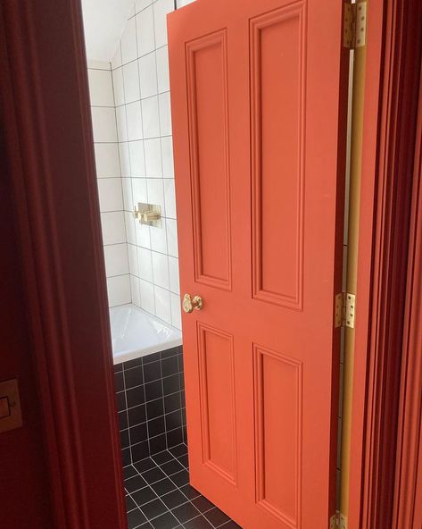 Red painted bathroom door Red Interior Door, Colourful Interior Doors, Red Interior Doors, Red Door Interior, Paint Doors Interior, Maroon Bathroom, Red Doors Interior, Coral Door, Mcm Interior