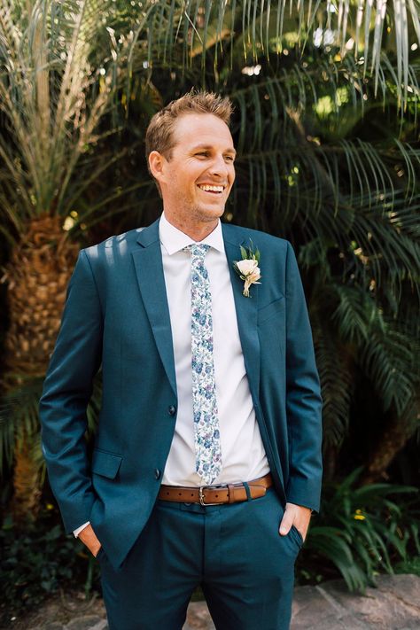 navy groom suit with floral printed tie #Wedding #Groom #GroomSuit #Casamento #Noivo Floral Tie Navy Suit, Navy Suit Floral Tie Wedding, Dark Teal Groom Suit, Tropical Wedding Groom, Tropical Wedding Suit, Teal Groom Suit, Teal Wedding Suit, Tropical Groomsmen, Navy Groom Suit