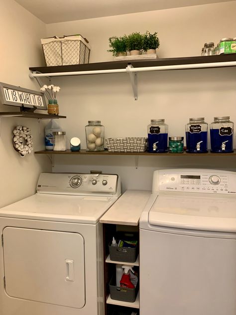 Laundry Room Organization In Garage, Shelves Above Laundry Washer And Dryer, Laundry Room One Shelf, Shelving Between Washer And Dryer, Washer And Dryer Organization, Washer And Dryer Storage Ideas, Shelf In Between Washer And Dryer, Washer Closet, Washer Dryer Organization