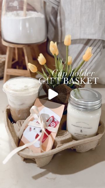 Ashley Hughes on Instagram: "A fun way to gift-give💐   Grab a used cup holder and use each spot to place some of their favorite things! A few other ideas could be 👇🏻 Chocolates or other treats Baked goods (cinnamon roll or 🍪) Essential oils Cozy socks Bath bomb Stanley or hydrojug Perfume Room spray The list goes on!   This would also be a fun way to bundle up some favorite things for mom on Mother’s Day! You could theme it like “garden items” or whatever her favorite hobbies are!🫶🏻 . . . . . . #mothersdaygift #mothersdaygiftideas #giftbasket #giftbaskets #cupholder" Cup Holder Gift Idea, Mothers Day For Friends, Sock Birthday Gift Ideas, Cup Holder Gift Basket, Mother’s Day Gift Idea For A Friend, Mothers Day Gift For Best Friend, Coffee Bouquet Gift Diy, Healthy Snack Gift Basket, Drink Holder Gift Basket