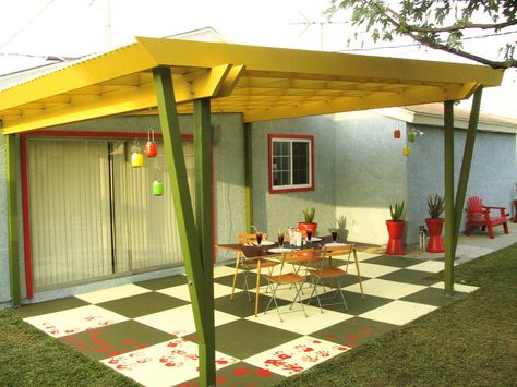 This oversized green-and-white checkerboard patio is the perfect canvas for the red handprints that adorn the outer edge, adding to the fun and retro feel of the backyard. Checkerboard Patio, Outdoor Flooring Options, Granite House, Porch Inspiration, Tree Deck, Ipe Decking, Checkerboard Floor, House Colours, Deck Designs