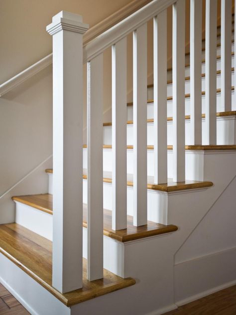 A square post and double handrail lead the way up this white, wooden staircase with natural wood steps. White Railing Stairs, All White Staircase, Stairs White, Wood Railings For Stairs, Stair Railing Makeover, Interior Stair Railing, Wrought Iron Stair Railing, Stair Ideas, White Staircase