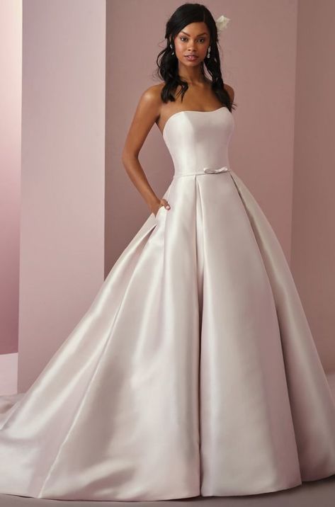 This Reena Mikado wedding dress features a strapless scoop neckline, box pleats, and pockets in the ballgown skirt. An attached Reena Mikado belt adds a touch of whimsy to this romantic style. Detachable Reena Mikado straps are also included for additional support. Finished with covered buttons and zipper over inner elastic. Mikado Wedding Dress, Rebecca Ingram, Chic Wedding Dresses, Maggie Sottero Wedding Dresses, Wedding Dress Boutiques, Silk Wedding Dress, Ball Gown Skirt, Affordable Wedding Dresses, Classic Wedding Dress