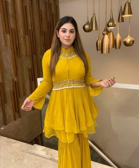 #peplum top with sharara dress #yellow sharara dress Yellow Outfit Dress, Peplum Top Outfits Indian, Peplum Top With Sharara, Aesthetic Design Ideas, Top With Sharara, Plazzo Suit, Saree Jacket Designs, Wedding Bollywood, Haldi Dress