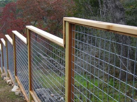 Privacy Fence On Hillside | Like the idea of stair stepping away from a centrally located gate ... Cheap Fencing, Wire Fence Panels, Pagar Modern, Ranch Fencing, Fencing Options, Field Fence, Fence Options, Deer Fence, Yard Fence