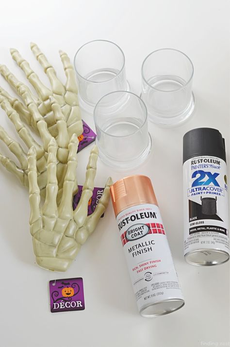 Painted Skeleton Halloween Decorations, Spray Painted Skeleton, Spray Paint Skeleton, Dollar Tree Halloween Skull Decor, Dollar Tree Halloween Candle Holders, Poolnoodle Diy Halloween Candle, Skeleton Hand Candle Holder Diy, Dollar Tree Skeleton Hands, Dollar Tree Skulls