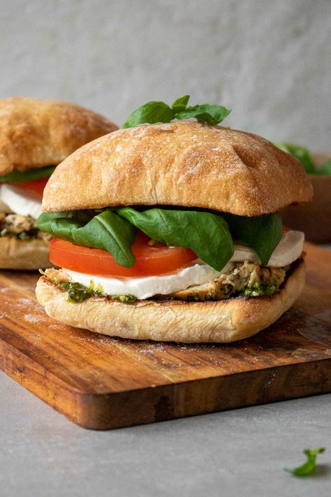 Layered with grilled chicken, fresh mozzarella, tomatoes, basil, and pesto, this chicken caprese sandwich is a quick, easy, and healthy meal. Chicken Caprese Sandwich, Chicken Avocado Sandwich, Kay Nutrition, Parmesan Sandwich, 2023 Meals, Team Meal, Chicken Pesto Sandwich, Chicken Caprese, Pesto Sandwich