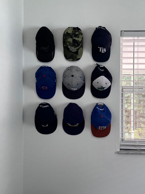 Hat Hanger Ideas Baseball Caps, Hanging Caps On Wall, Cap Hanging Ideas, Hats On The Wall Decor, Cap Organization Ideas, Hat Organization Wall, Hats On Wall, Room Decor For Men Bedroom, Hat Wall Display