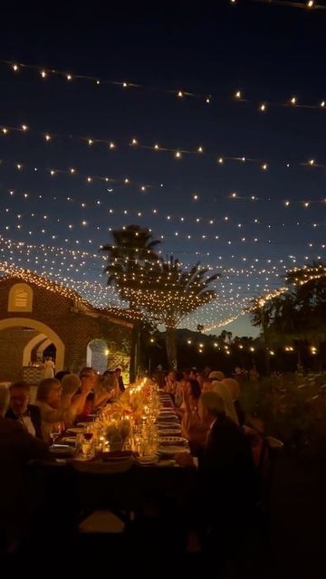 The Knot shared a post on Instagram: "Breathless over this moment under the stars. ✨🌙 #TheKnot | @TheKnot 🎥: @o.skifilms". Follow their account to see 9309 posts. Night In Venice Prom Theme, Backyard Wedding Night Lights, Fairy Lights Backyard, Midsummer Nights Dream Party Theme, Fairy Lights Wedding Reception, Dinner Party Lighting, Rooftop Lighting, Bonfire Wedding, Tangled Wedding